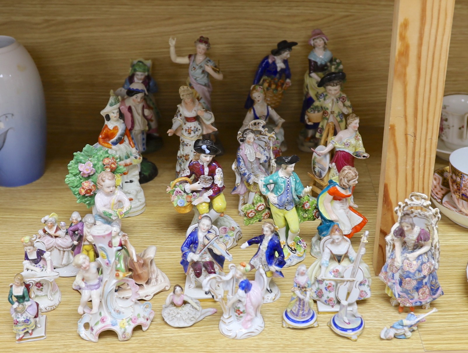 A group of small continental porcelain figures, to include Dresden and others